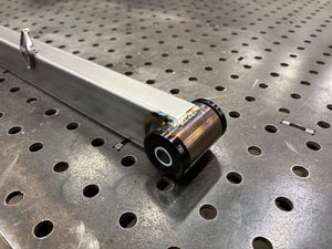 Metal rod with a cylindrical component on a perforated metal surface