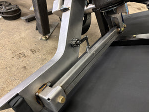 Close-up of a accuair height sensor attached to 4 link arm in chassis assembly