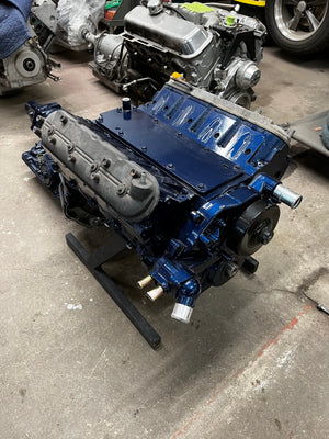 Blue LS engine on a stand with other engines in the background