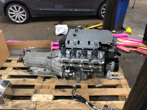 GM LT1 and 8L90e sitting on a crate in a shop environment