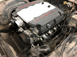 LT1 engine with 'Camaro' branding on a mechanical background
