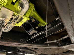 Close-up of a mechanical component inside a vehicle, possibly a clutch or transmission part.