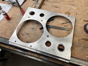 Aluminum Fan Shroud on a wooden workbench with tools and parts around