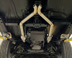 Close-up of a car's undercarriage with suspension components.