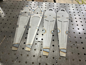 Metal brackets on a perforated metal surface