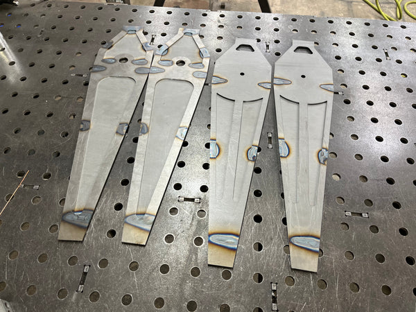 Metal brackets on a perforated metal surface
