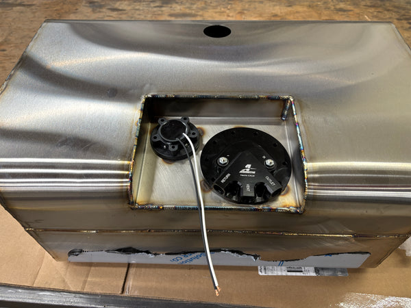 Stainless fuel tank assembly showing fuel pump module and level sender installed