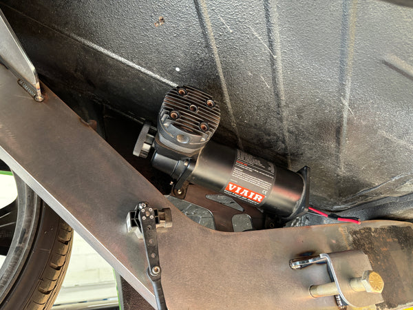 VIAIR compressor mounted under a vehicle