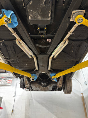 Car on a lift with undercarriage inspection in a garage