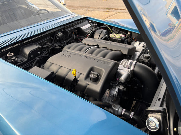 LS3 engine compartment with 'Corvette' branding on a blue 1969 Corvette.